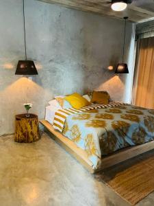 a bedroom with a large bed and a table at Casa Carmela 