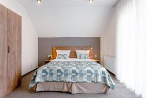 Voodi või voodid majutusasutuse AuRoom Bakuriani Resort toas