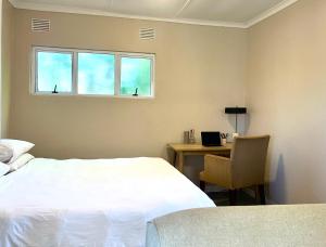 Postel nebo postele na pokoji v ubytování Lochry Guest Suite + 14 fotografií
