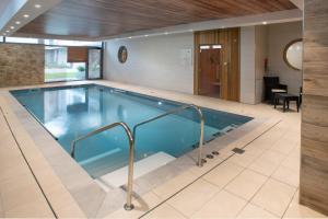 a large swimming pool in a house with at Domitys - Les Aiglons Blancs in Briançon