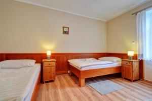 Postel nebo postele na pokoji v ubytování Penzion pod Radyni