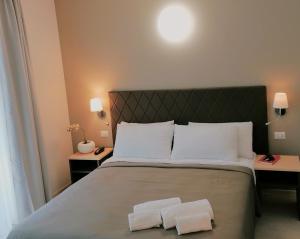 Postel nebo postele na pokoji v ubytování Hotel Boston