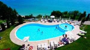 an overhead view of a swimming pool with people in the water at Плажни Апартаменти Силвър Бийч - Silver Beach Sea Apartments in Byala +31 photos