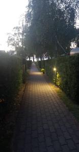 a brick path with a light at the end at Fonyód Camping & Apartman in Fonyód