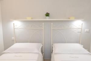 Letto o letti in una camera di Borgo Diaz