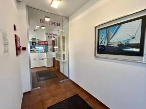 a hallway of a museum with a large window at Penzion Félix in Topoľčany