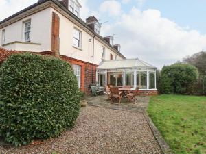 a house with a garden and a gazebo at Croylands in North Walsham