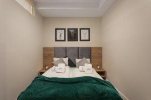 Posteľ alebo postele v izbe v ubytovaní Green Park Resort B19- z dostępem do basenu, sauny, jacuzzi, siłowni + 23 fotografií