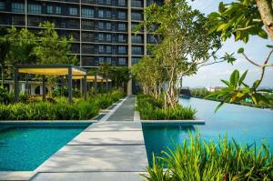a swimming pool in front of a building at Wallaway2stay Gravit8 Klang 2Room in Klang