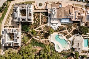 an aerial view of a resort with a pool at Kimpton Aysla Mallorca by IHG in Santa Ponsa