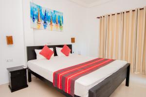 Katil atau katil-katil dalam bilik di Nico Beach Hotel