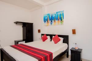 Katil atau katil-katil dalam bilik di Nico Beach Hotel