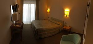 Postel nebo postele na pokoji v ubytování Savant Hotel