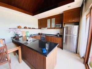 Kuchyň nebo kuchyňský kout v ubytování Tina Holiday Homes