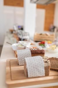 a kitchen counter with bread on a cutting board at Winzervilla Klöch in Klöch