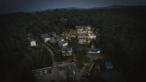 an aerial view of a house in the middle of a forest at The Blossom Resort - Chikmagalur in Chikmagalūr