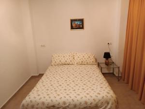 Postel nebo postele na pokoji v ubytování CAL TIO PAU