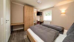 Ein Bett oder Betten in einem Zimmer der Unterkunft Haus am Parc