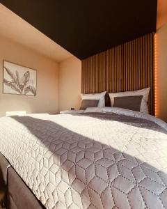 a bedroom with a large bed in a room at Private Spa Lodge Odenwald in Lindenfels