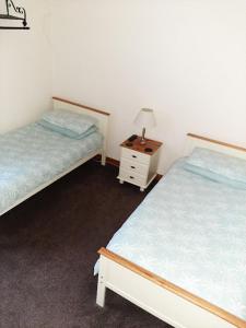 Ένα ή περισσότερα κρεβάτια σε δωμάτιο στο Mirandas Guest House
