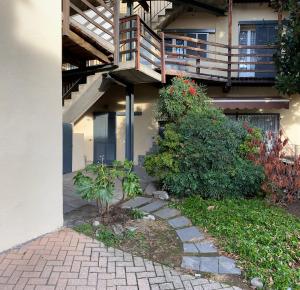 a house with a staircase on the side of it at vicolo forno in Mercallo