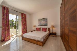 En eller flere senge i et værelse på Magnífica villa en de playa de Muro