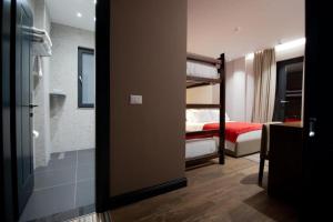 Postel nebo postele na pokoji v ubytování Mergan Hotel