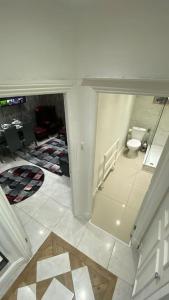 an overhead view of a bathroom with a toilet at Seymour - Marble Arch, Mayfair Apartments hosted by Maysa London in London