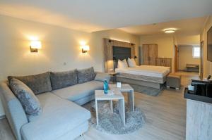 Postel nebo postele na pokoji v ubytování Hotel Grasberger Hof GmbH