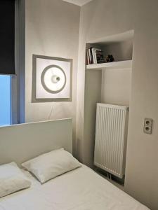 Säng eller sängar i ett rum på Sublime appart cocoon au coeur de Liège