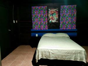 Postel nebo postele na pokoji v ubytování ECO-CABAÑAS Cancún