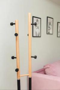 two bamboo poles in a room with a bed at Tsimiski #apartment (one bedroom) in Thessaloniki
