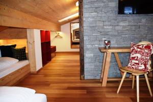 Postel nebo postele na pokoji v ubytování Alpinhotel Bort