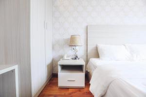Postel nebo postele na pokoji v ubytování TTR Vincent Hotel