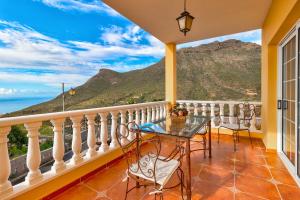 a balcony with a view of the ocean and mountains at Bonita Casa Arianny By Paramount Holidays in Arona