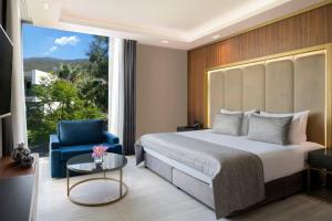 Postel nebo postele na pokoji v ubytování Vogue Hotel Supreme Bodrum