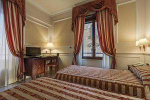 Postel nebo postele na pokoji v ubytování Palazzo Cardinal Cesi + 33 fotografií