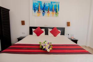 Katil atau katil-katil dalam bilik di Nico Beach Hotel