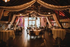 a dining room with tables and chairs in it at Hotel Gutshof Herborn in Herborn