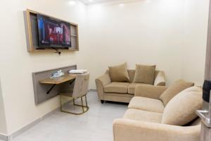 TV in/ali zabaviščno središče v nastanitvi DUQUM PLAZA HOTEL