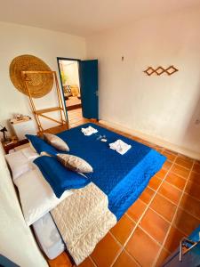 Un pat sau paturi într-o cameră la Montepascual Ecovillage