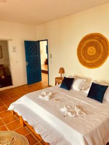 A bed or beds in a room at Montepascual Ecovillage