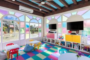 a living room with a play room with a toy house at Hacienda Resort in Cabo San Lucas