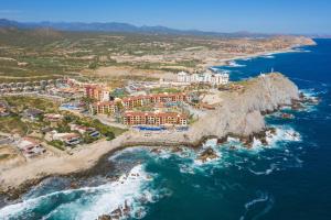 an aerial view of a resort next to the ocean at Hacienda Resort in Cabo San Lucas +85 photos