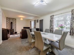 a dining room with a white table and chairs at Toadlands Farm in Eastville