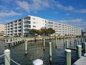 a large white building on the water with a marina at Thunder Island 157D condo in Ocean City