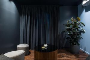 a living room with a table and a potted plant at Lava in Donostia-San Sebastián