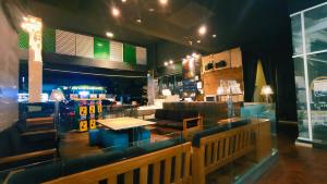 a restaurant with a bar with a table and chairs at JB Twin Galaxy Residence near KSL Mall and NewYorkHotel in Johor Bahru