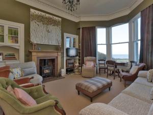 a living room filled with furniture and a fireplace at Bentfield in Prestwick