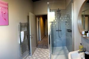 a bathroom with a shower and a sink at University Duplex • Sleeps 6 in Loughborough